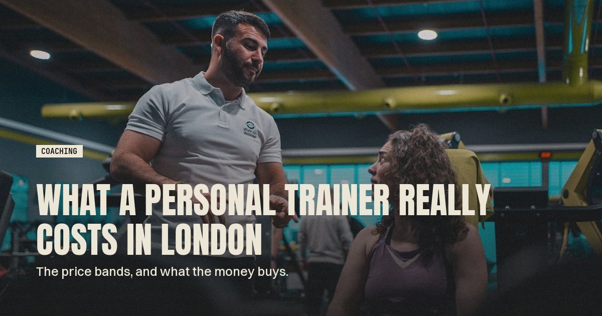 Personal trainer talking a client through their session plan in the gym